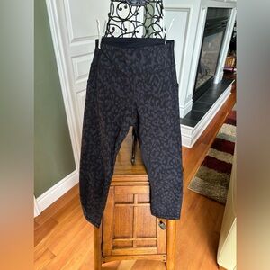 Women’s size 6 Lululemon short yoga pants with sheer black back panel on calf.